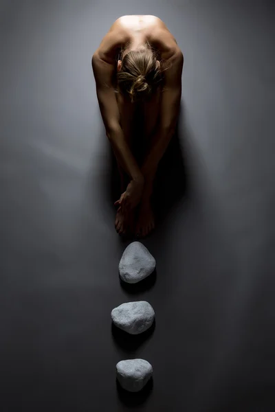 Top view of sensual nude woman and stones — Stock Photo, Image