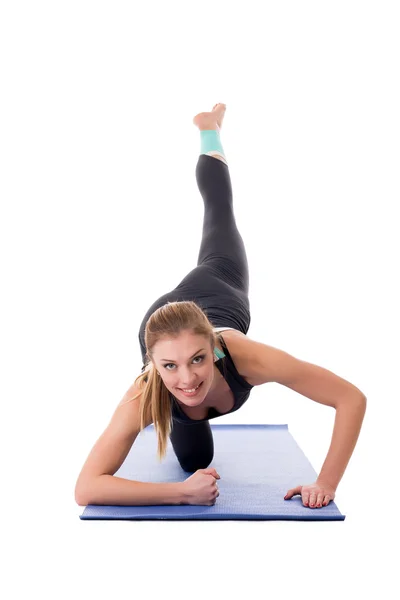 Sorrindo menina fazendo exercício de fitness — Fotografia de Stock