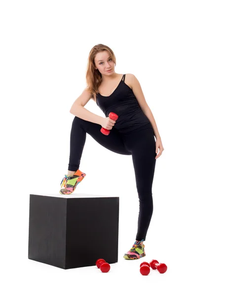 Pretty girl doing pilates exercises at camera — Stock Photo, Image