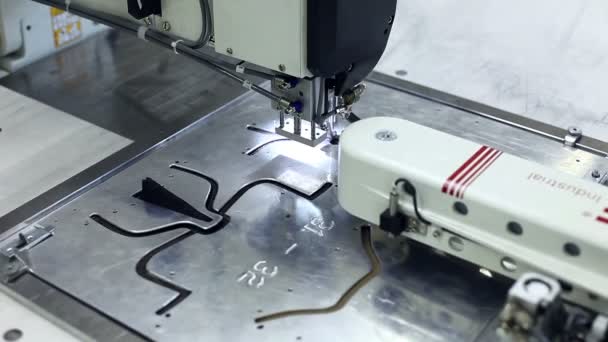 Sewing machine stitching on metal patterns — Stock Video
