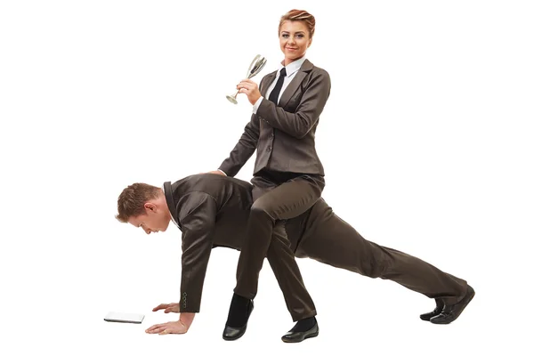 Relaxed businesswoman riding on man working — Stock Photo, Image