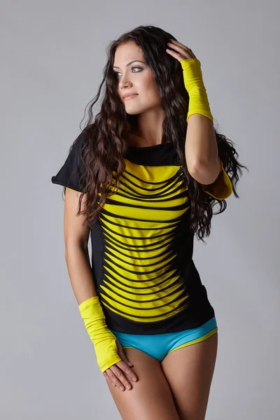 Charming long-haired woman dressed in sportswear — Stock Photo, Image