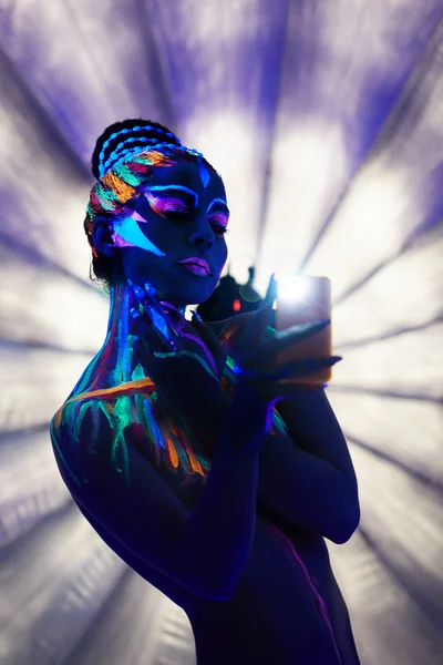 Beautiful girl with glowing body art makes selfie — Stock Photo, Image