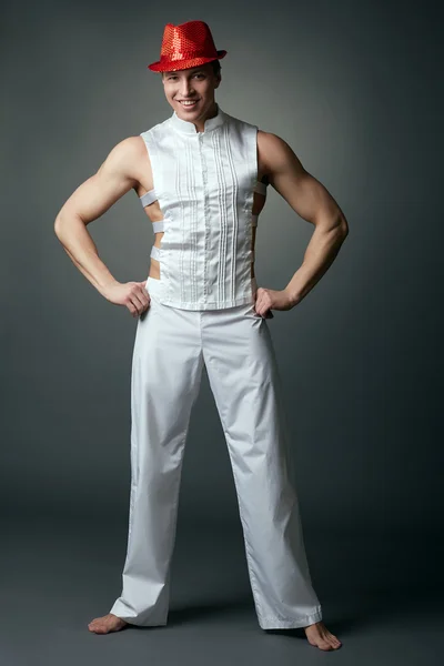 Smiling muscular male dancer posing barefoot — Stock Photo, Image