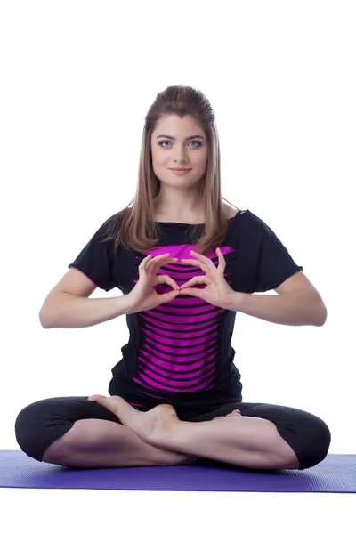 Charming woman posing in lotus position — Stock Photo, Image