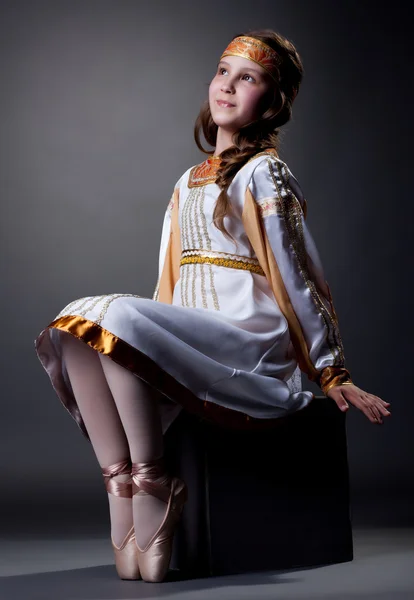 Dreamy little ballerina posing in folk dress — Stock Photo, Image