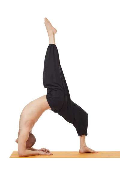 Yoga exercise. Instructor posing in difficult pose — Stock Photo, Image