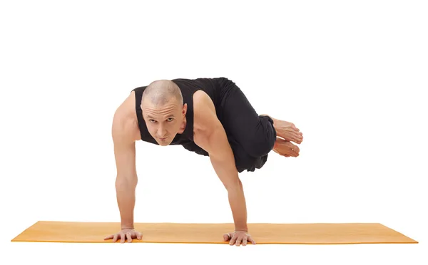 Yoga instructor looking at camera while exercising — Stock Photo, Image