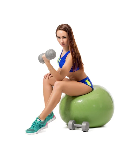 Cute female athlete exercising with dumbbells — Stock Photo, Image