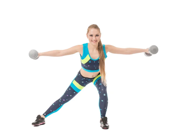 Smiling female athlete exercising with dumbbells — Stock Photo, Image