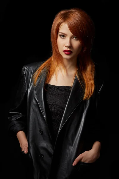 Sexy red-haired model posing in leather jacket — Stock Photo, Image