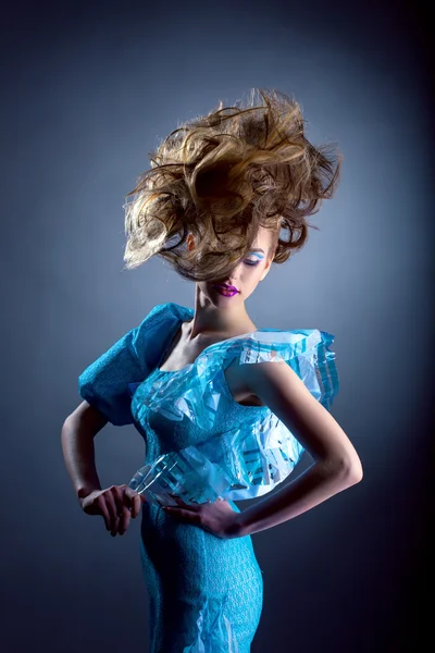 Creative model posing in blue dress Royalty Free Stock Photos