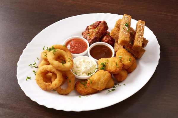 Fast food. Dish with snacks and sauces, close-up — Stock Photo, Image