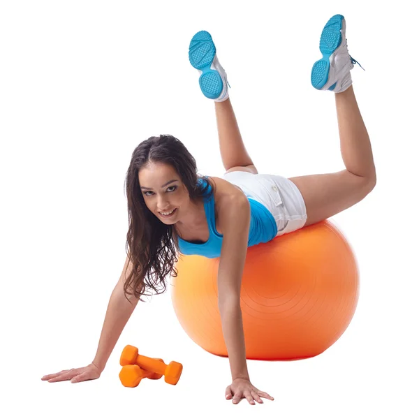 Sexy woman posing while exercising on fitness ball — Stock Photo, Image