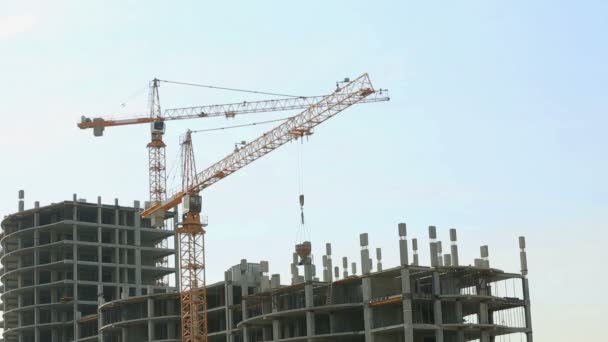 View of cranes working on building site — Stock Video