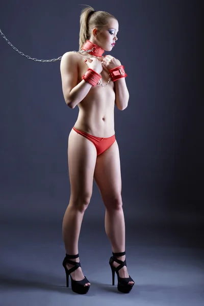 BDSM. Sexy girl posing in handcuffs and on leash — Stock Photo, Image