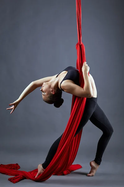 Aerial silk. Pretty young dancer posing at camera — Stockfoto