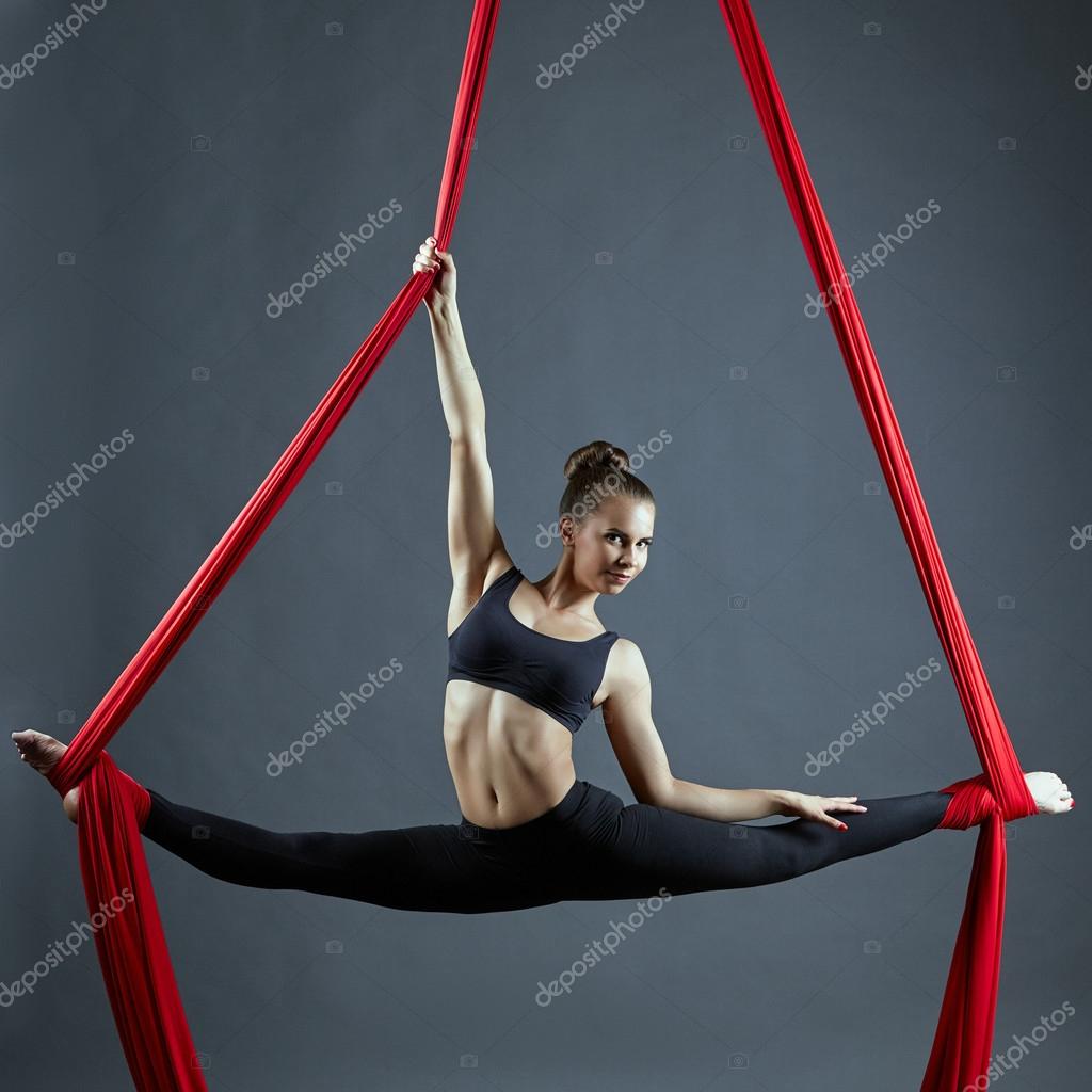 Cute dancer doing gymnastic split on aerial silks — Stock Photo © Wisky  #76390135