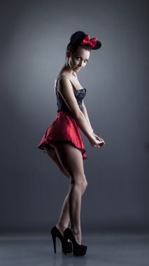 Sexy coquette posing in role-suit with mouse ears