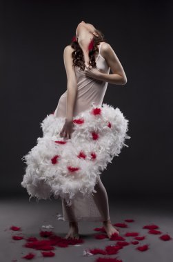 Photo concept. Angel with wounded wings