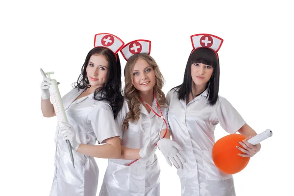 Vackra unga kvinnor klädda kostymer av sjuksköterskor — Stockfoto