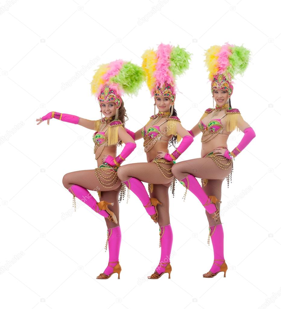 Sexy female dancers dressed in carnival costumes