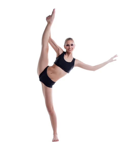 Smiling blonde posing doing vertical split — Stock Photo, Image