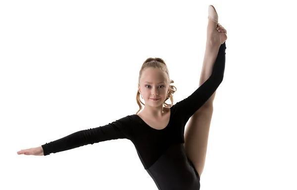 Nice little gymnast posing doing vertical split — Stock Photo, Image