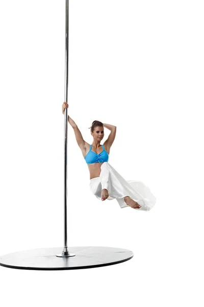 Image of charming female dancer spinning on pole — Stock Photo, Image