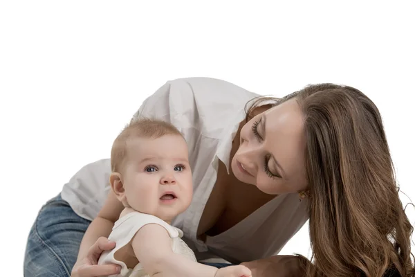Smiling mother looking at her adorable daughter Stock Image