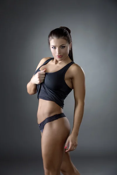Hot athletic woman invitingly looking at camera — Stock Photo, Image