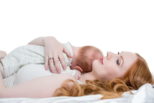 Loving mother put her little child to breast — Stock Photo, Image