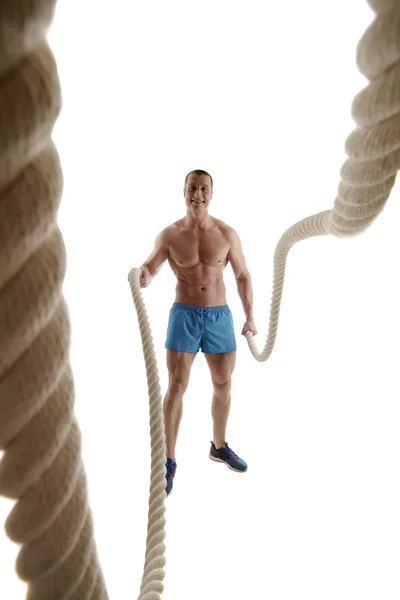 Studio shot of cheerful athlete with ropes — Stock Photo, Image