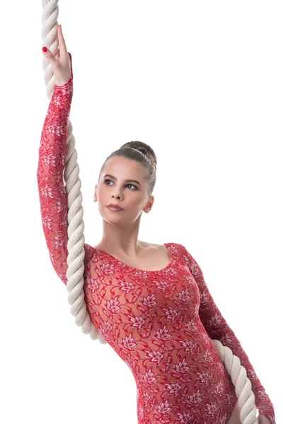 Attractive dark-haired gymnast posing with rope — Stock Photo, Image