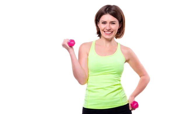 Deporte mujer haciendo lado doblas con mancuernas — Foto de Stock