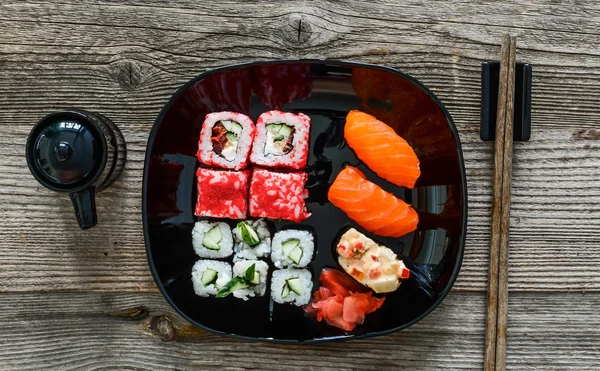 Sushi on plate with chopsticks — Stock Photo, Image