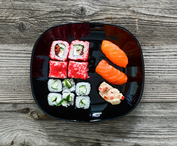 Various sushi on white plate — Stock Photo, Image