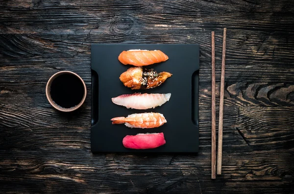 Set of sashimi sushi with soy and chopsticks — Stock Photo, Image