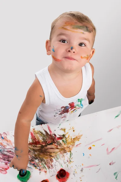 Little boy painting with fingers Royalty Free Stock Images