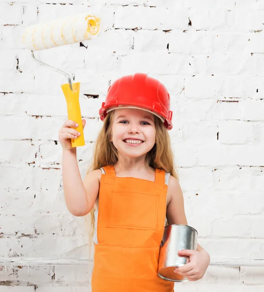 Little girl-worker with paint and roller in hands — Stock Photo, Image