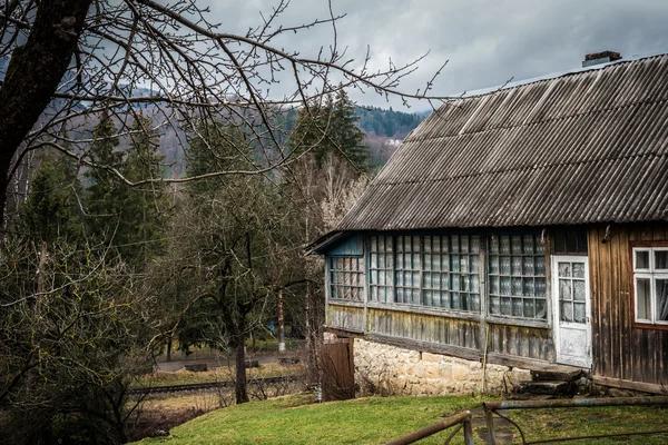 scenic landscape with cabin in mountains