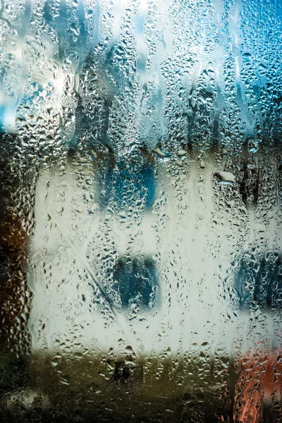 image of white house through wet glass