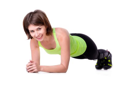 Spor kadın yerde tahta egzersiz yaparak