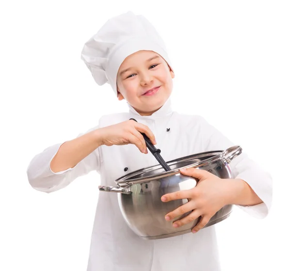 Riant petit garçon-cuisinier avec poêle dans les mains — Photo