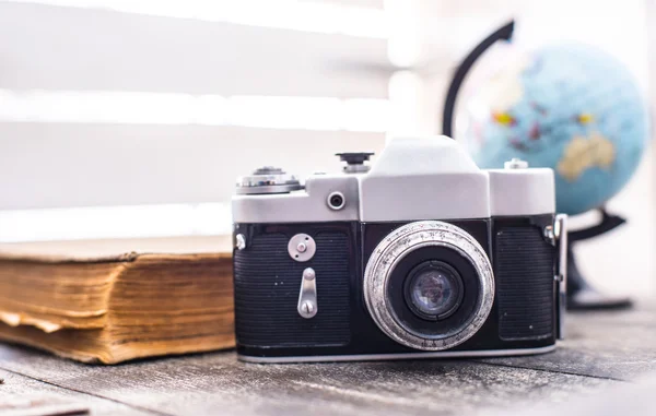 Rarity camera zenit with globe on the background — Stock Photo, Image