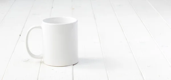 White empty cup on white table — Stock Photo, Image