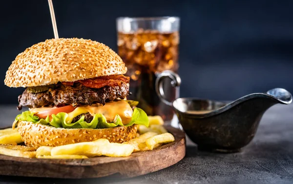 Appetizing burger on wooden board — Stock Photo, Image