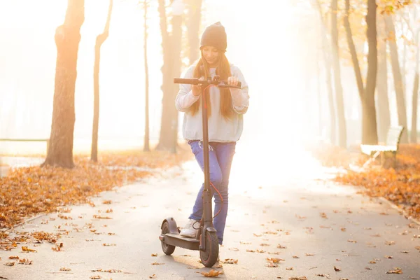 Cute girl on scooter — Stock Photo, Image