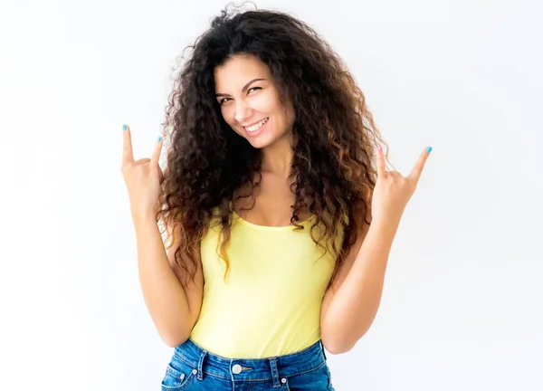 Girl showing devil horns gesture — Stock Photo, Image