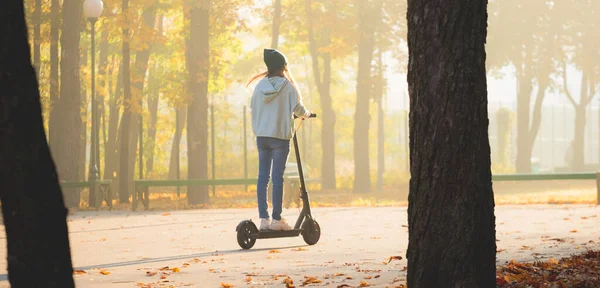 Cute girl on scooter — Stock Photo, Image